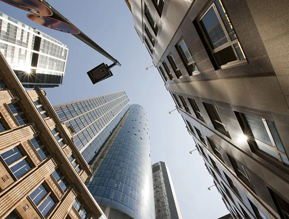 Buildings seen from the ground, glass and stone facades