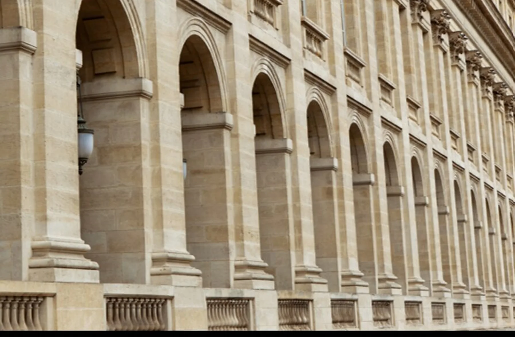 Classical arcaded facade of a Parisian palace in dressed stone